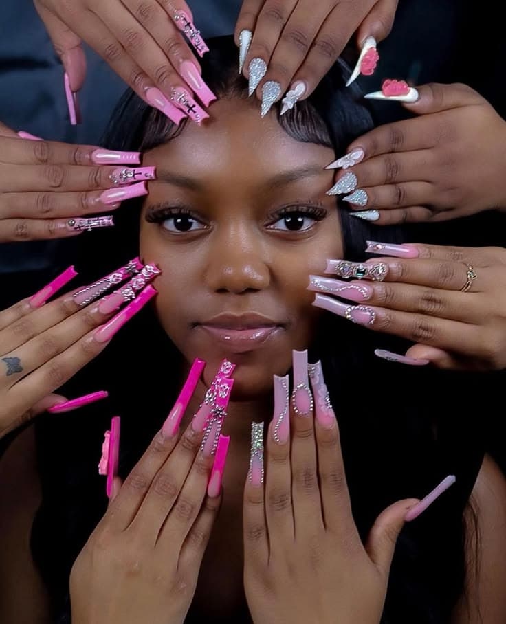 Dramatic editorial: multiple hands with long pink nail art surrounding a face