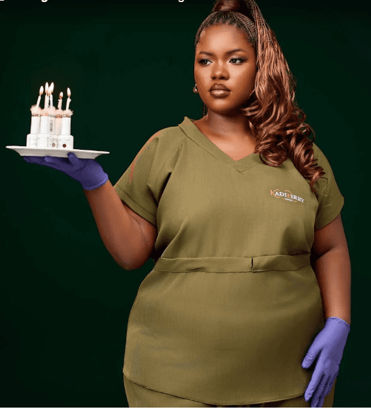 Kadi Perry Nails CEO in her salon uniform